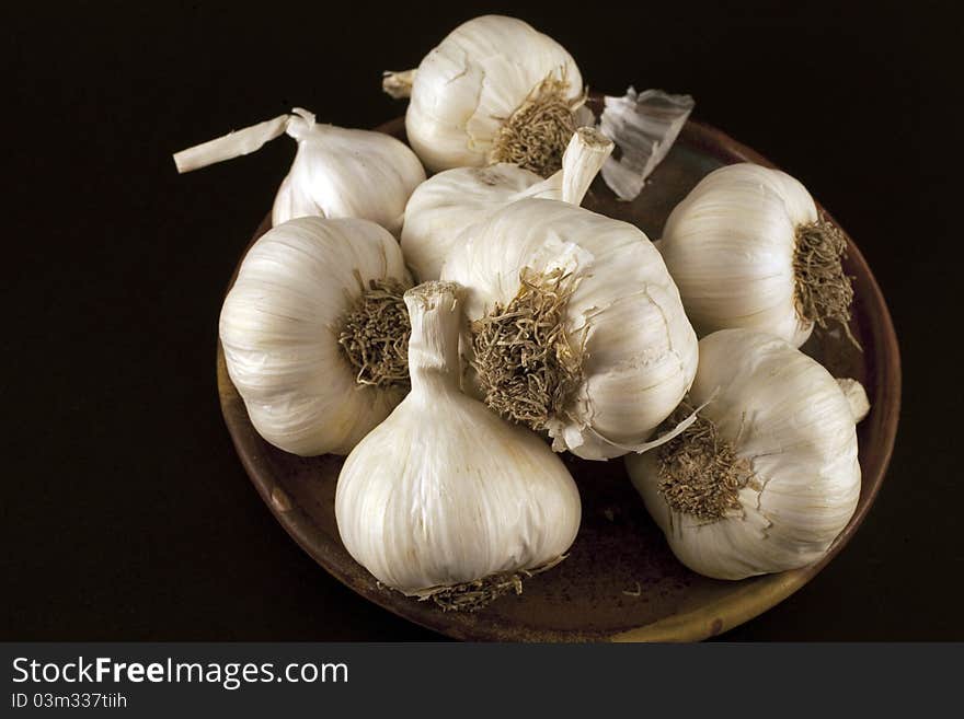 Fresh garlic on a black background. Fresh garlic on a black background