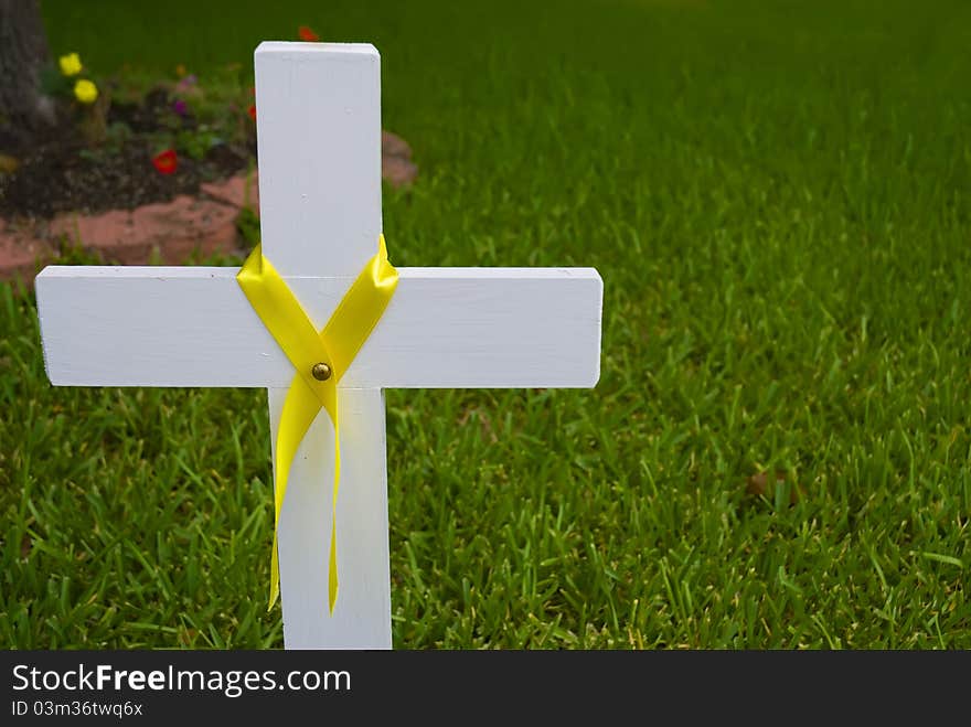 White cross with yellow ribbon