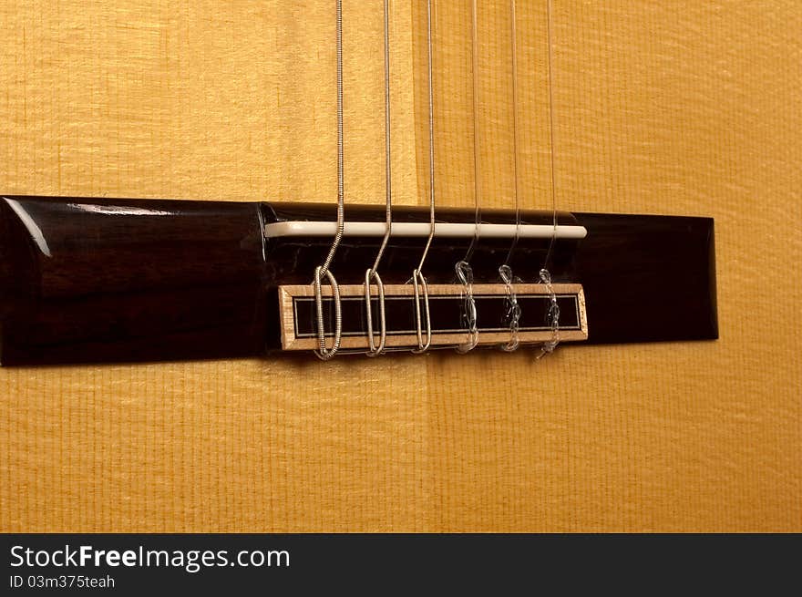 Close Up Of Classical Guitar Bridge