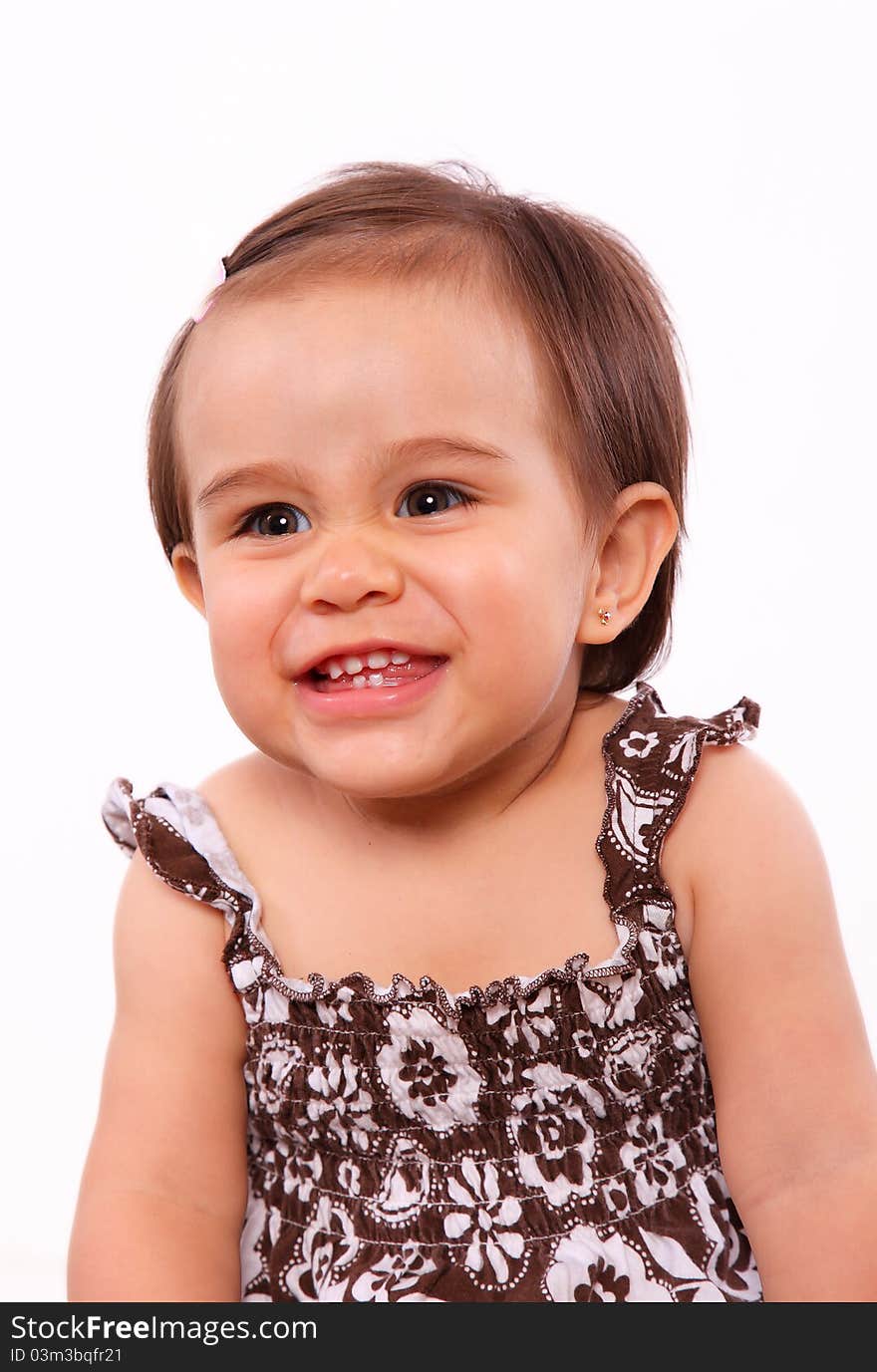 Smiling baby girl isolated over white background. little