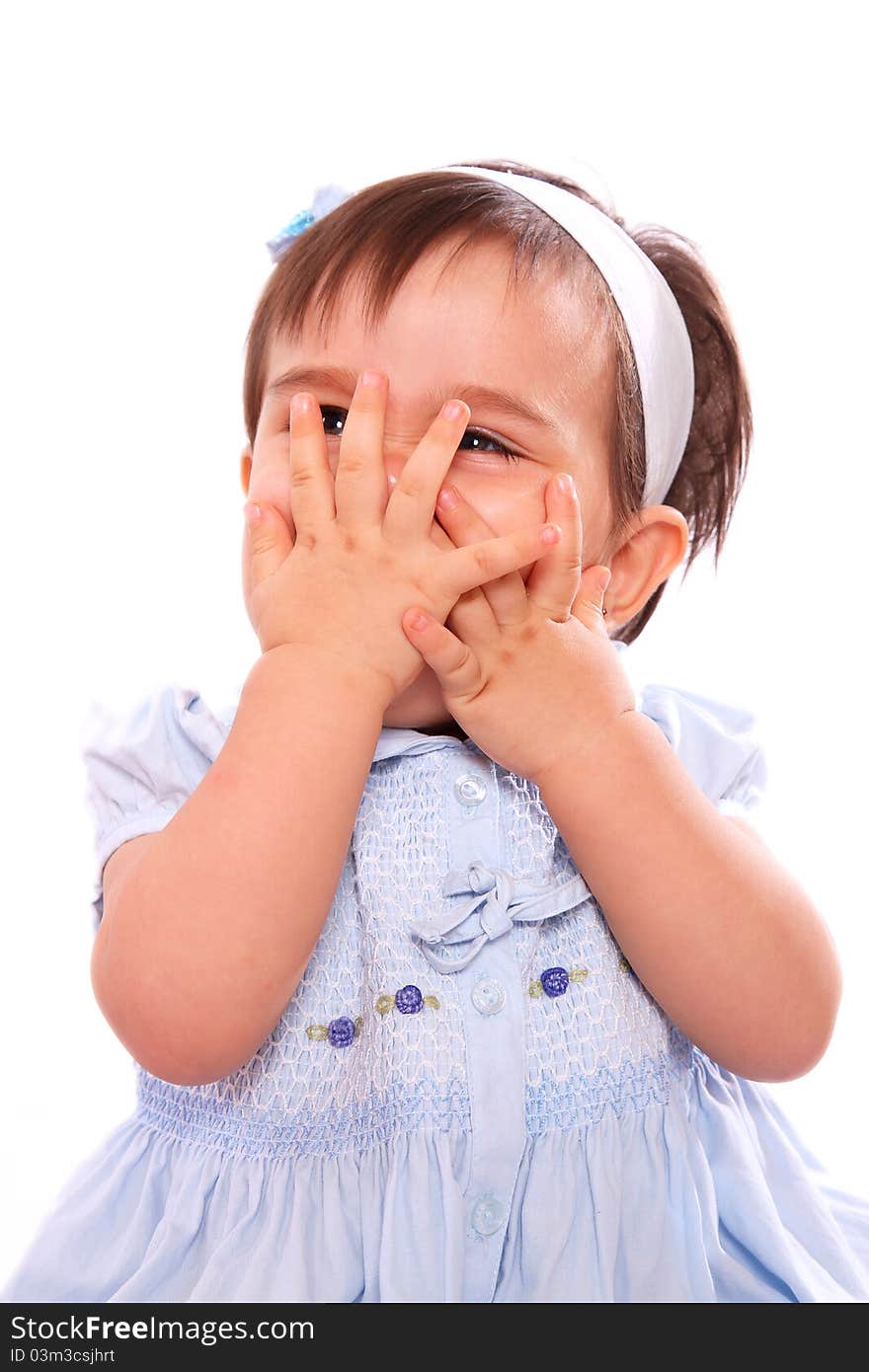 Beauty baby with hands on her face on white background. Beauty baby with hands on her face on white background