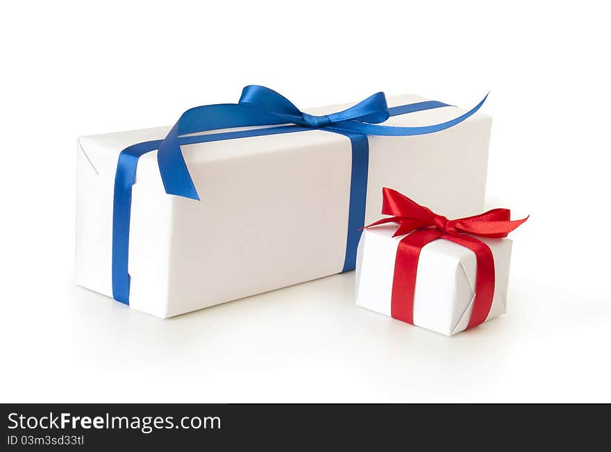 Roll of paper with gift box on white background