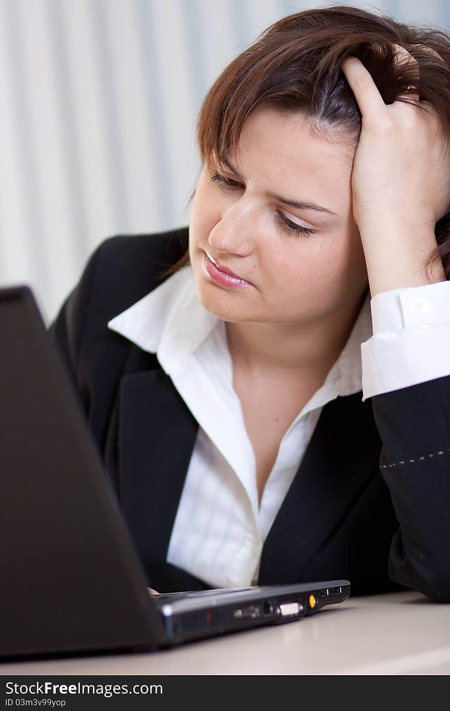 Beautiful business woman thinking about somethinking while working