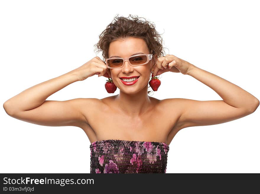 Closeup portrait of young female holding strawberry like earrings, isolated on white background. Closeup portrait of young female holding strawberry like earrings, isolated on white background