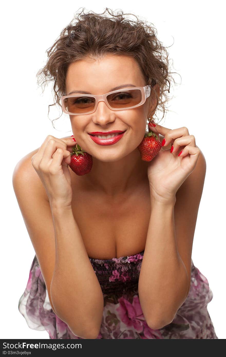 Closeup portrait of young female holding strawberry like earrings, isolated on white background. Closeup portrait of young female holding strawberry like earrings, isolated on white background