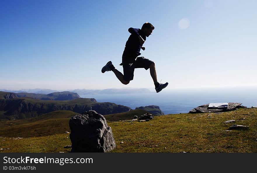 Jumping at the dramatic Cape Vestkapp