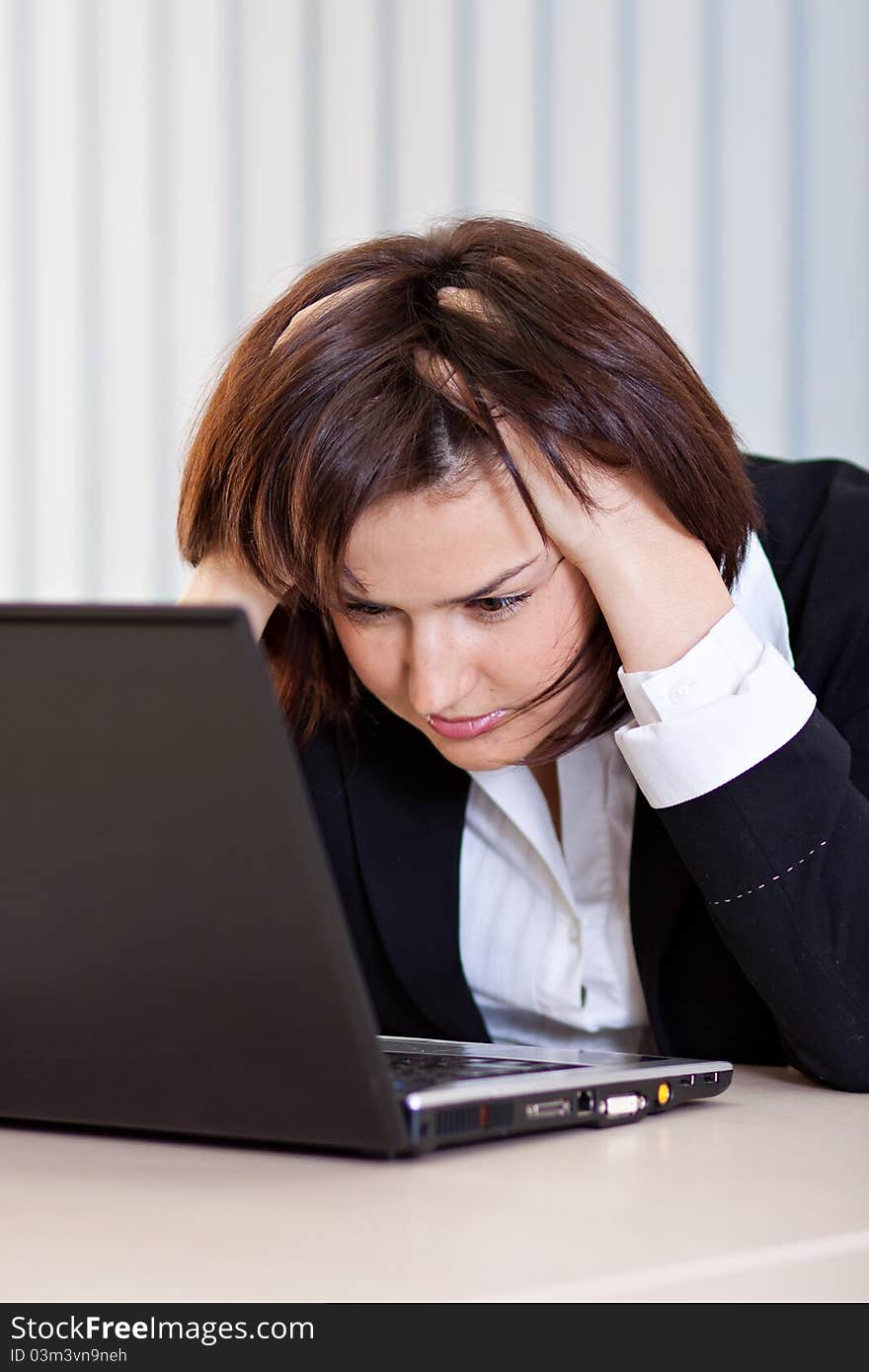 Beautiful business woman thinking about somethinking while working