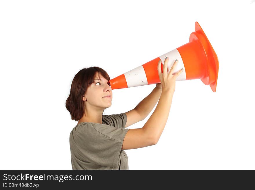 Girl looking for something with a orange traffic cone