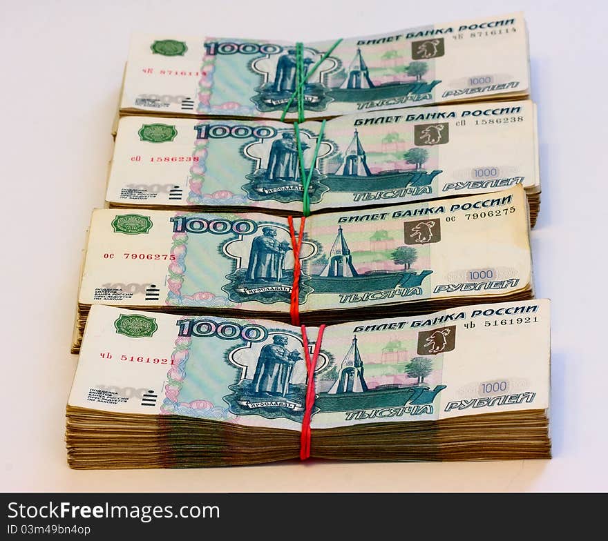 Cash, banknotes of one thousand russian rouble posted on the table. Cash, banknotes of one thousand russian rouble posted on the table