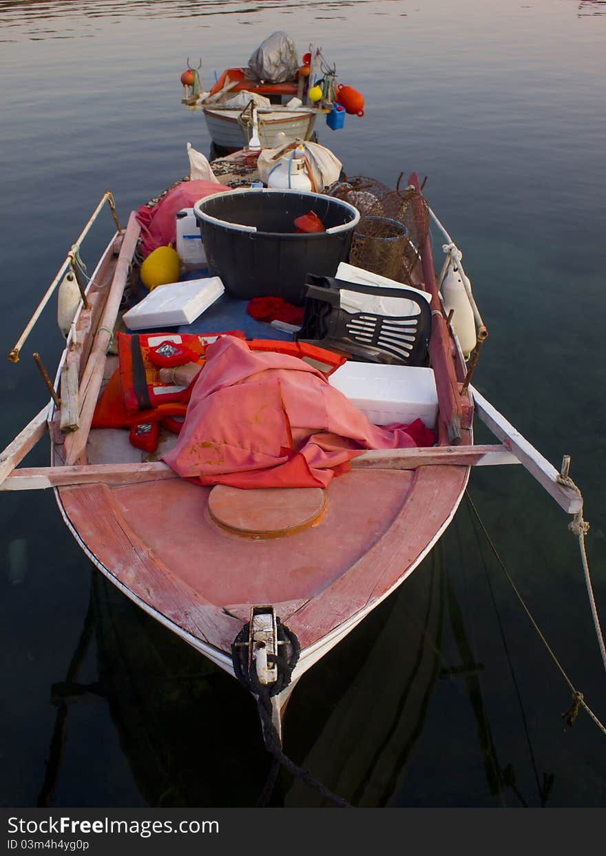 Old boat with fishing equipment on the sea. Old boat with fishing equipment on the sea