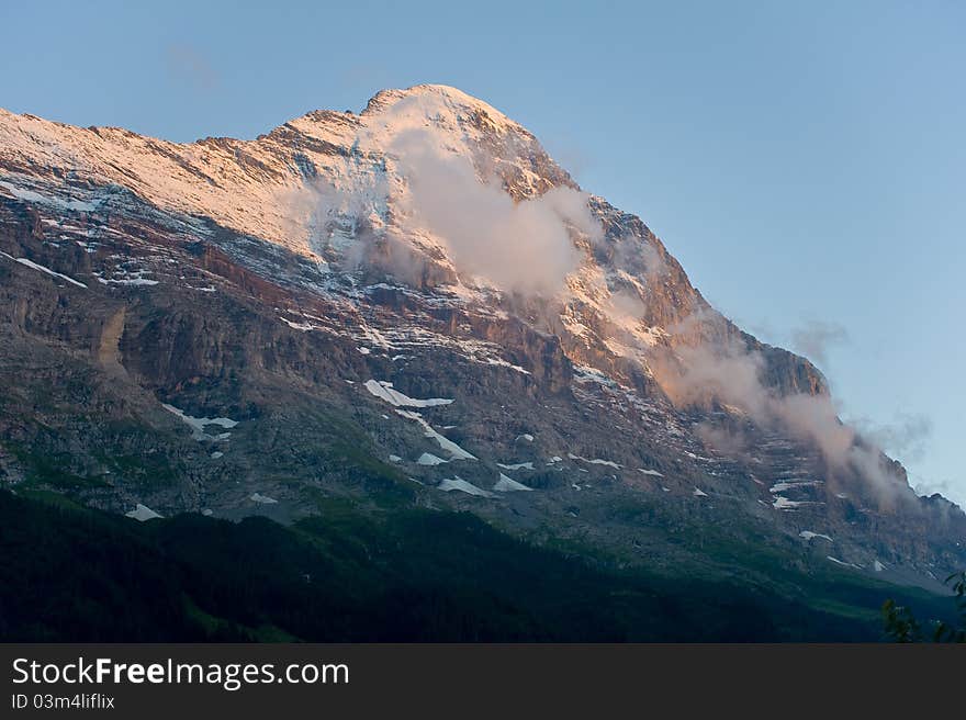 The Eiger is a mountain in the Swiss Alps in Grindelwald (Bernese Oberland) with a high of 3970 m. 
The first ascent of the Eiger was made by Swiss guides Christian Almer and Peter Bohren and Irishman Charles Barrington who climbed the west flank on August 11.1858. The first ascent  of the north face was made 1938 by Anderl Heckmair and Ludwig Vörg from Austria and the Germans Heinrich Harrer and Fritz Kasparek. The Eiger is a mountain in the Swiss Alps in Grindelwald (Bernese Oberland) with a high of 3970 m. 
The first ascent of the Eiger was made by Swiss guides Christian Almer and Peter Bohren and Irishman Charles Barrington who climbed the west flank on August 11.1858. The first ascent  of the north face was made 1938 by Anderl Heckmair and Ludwig Vörg from Austria and the Germans Heinrich Harrer and Fritz Kasparek.