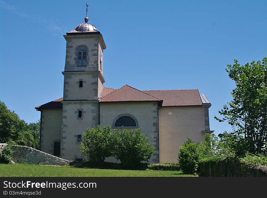 Clermont church in haute savoie against blue sky in french alps