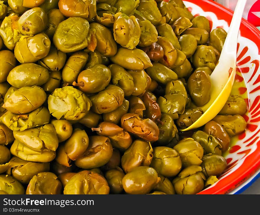 Fermented olives in colorful plate. Fermented olives in colorful plate