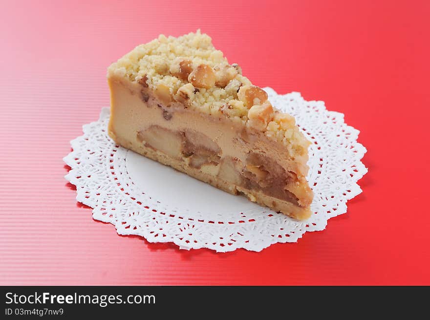 Macadamia Cheese cake on red background