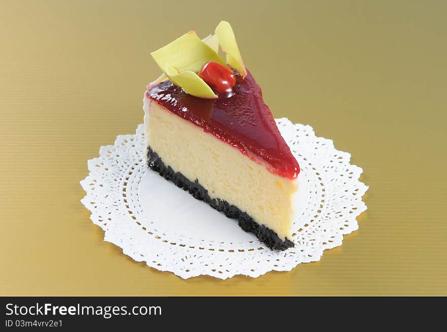 Cherry cheesecake with white round paper on yellow background. Cherry cheesecake with white round paper on yellow background.