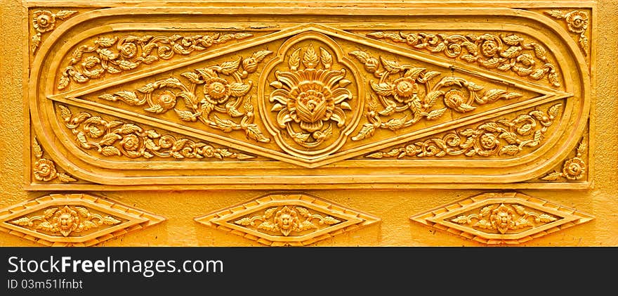 Golden Thai pattern desing on temple wall