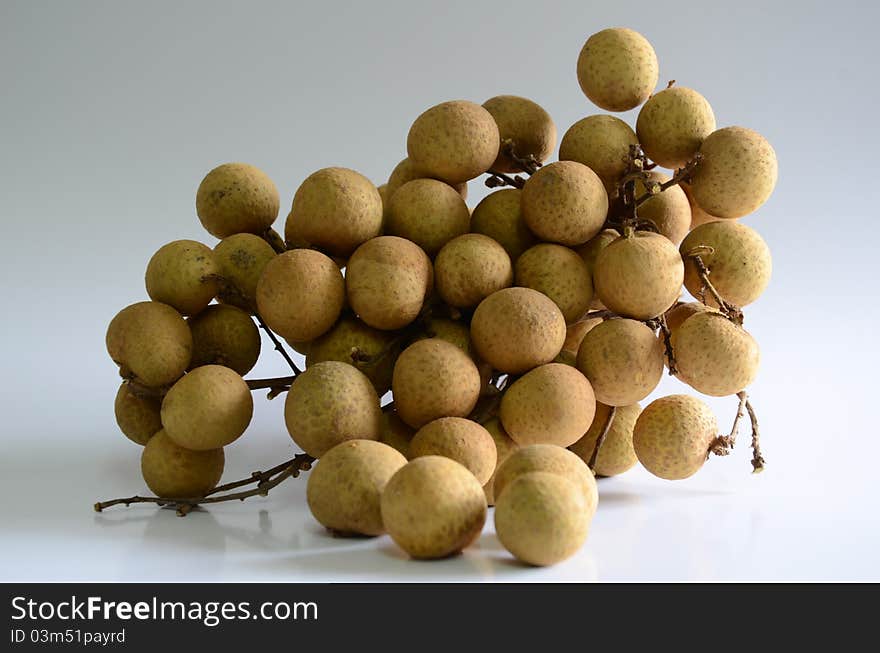 Longan - sweet fruit on a white background. Longan - sweet fruit on a white background.