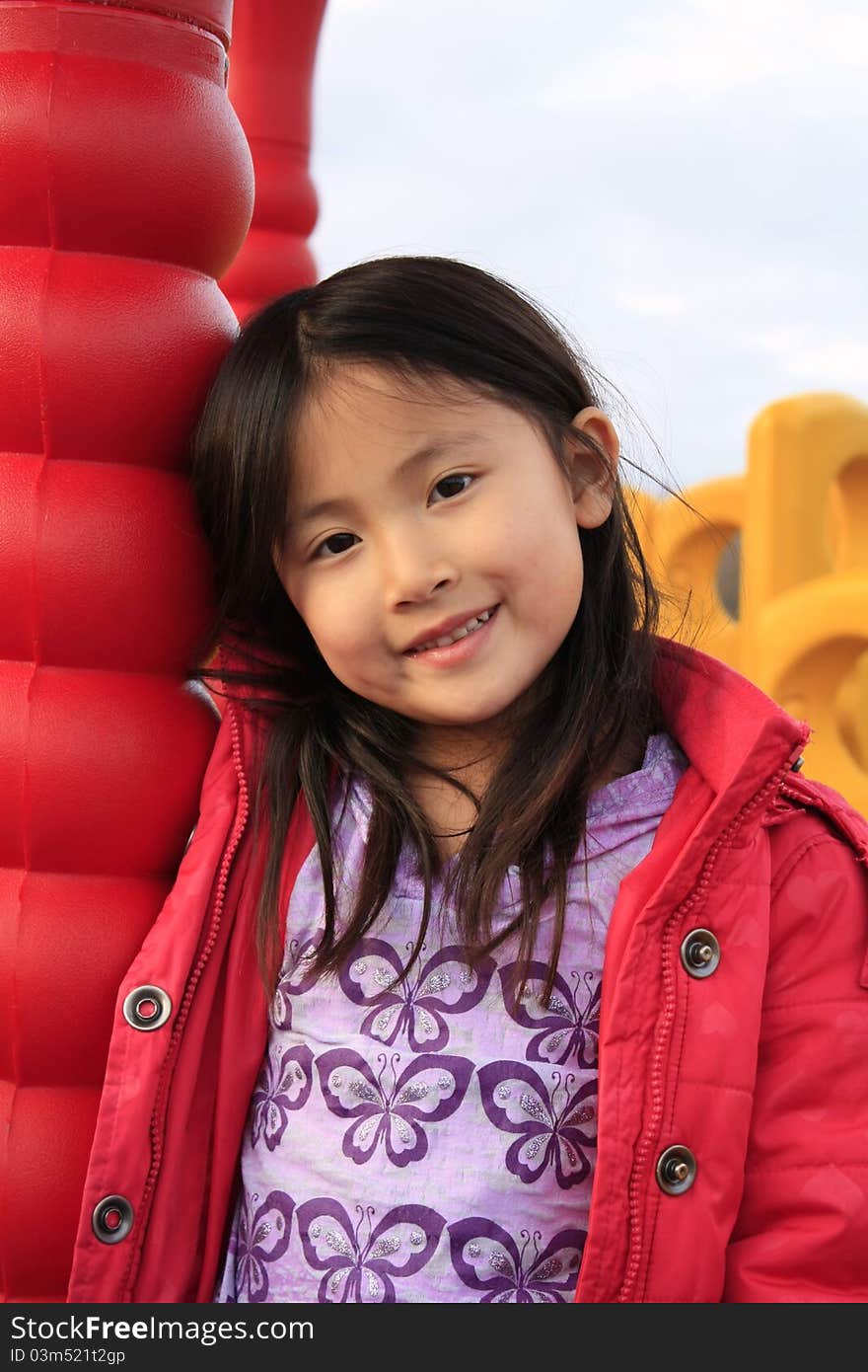 Cute Chinese girl in red jacket.