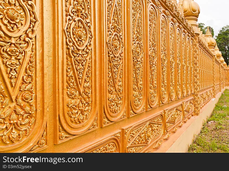 Golden Thai pattern desing on temple wall tilted out. Golden Thai pattern desing on temple wall tilted out