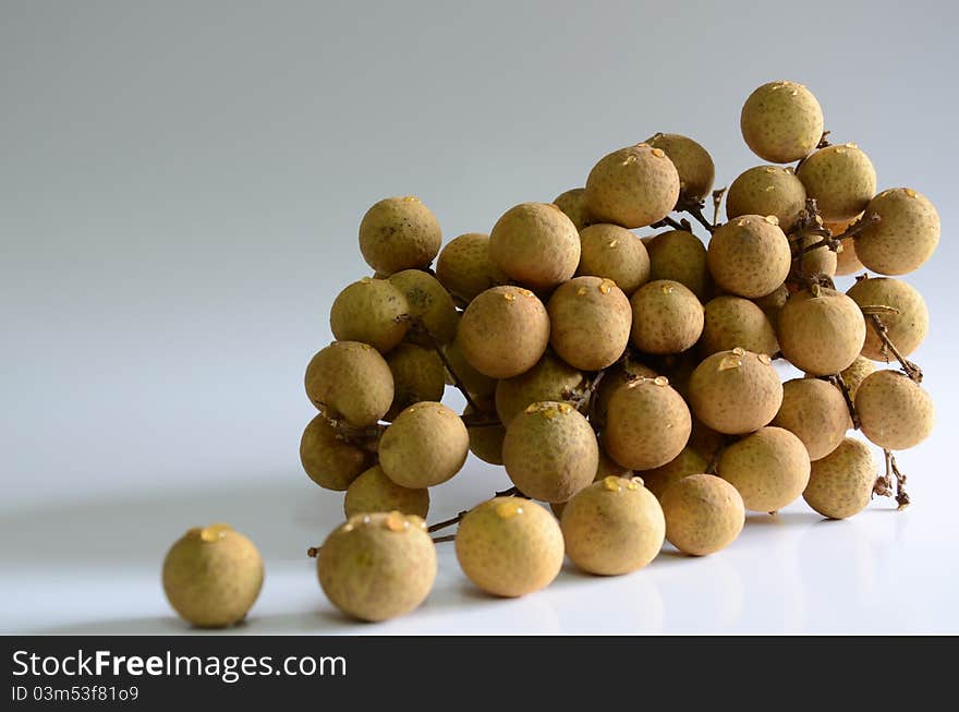 Longan - sweet fruit on a white background. Longan - sweet fruit on a white background.