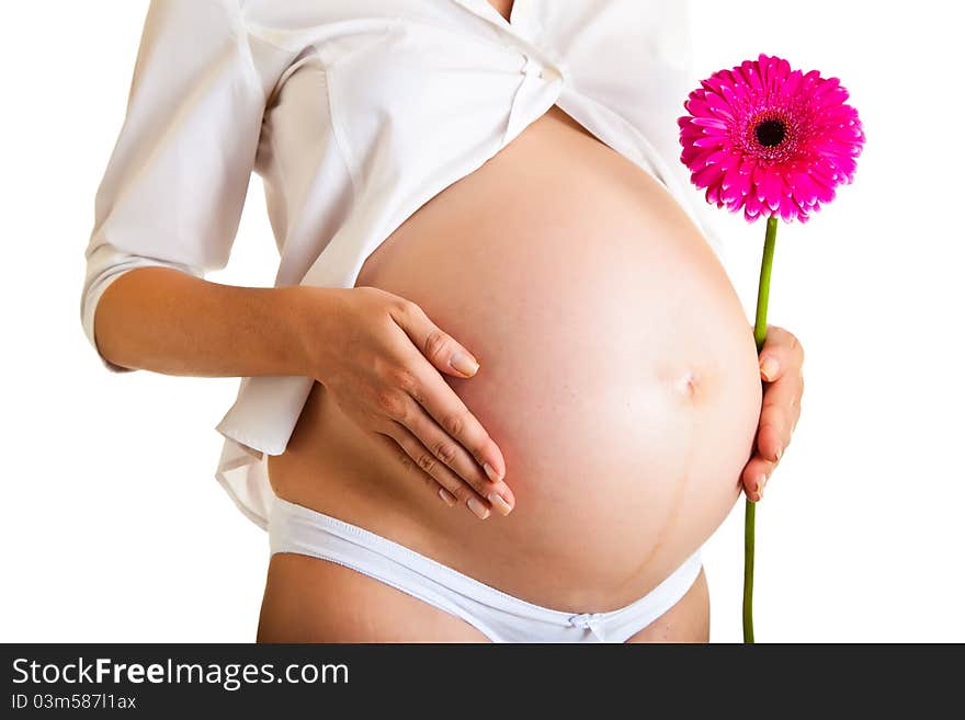 Pregnant woman holding gerbera flower isolated on white. Pregnant woman holding gerbera flower isolated on white