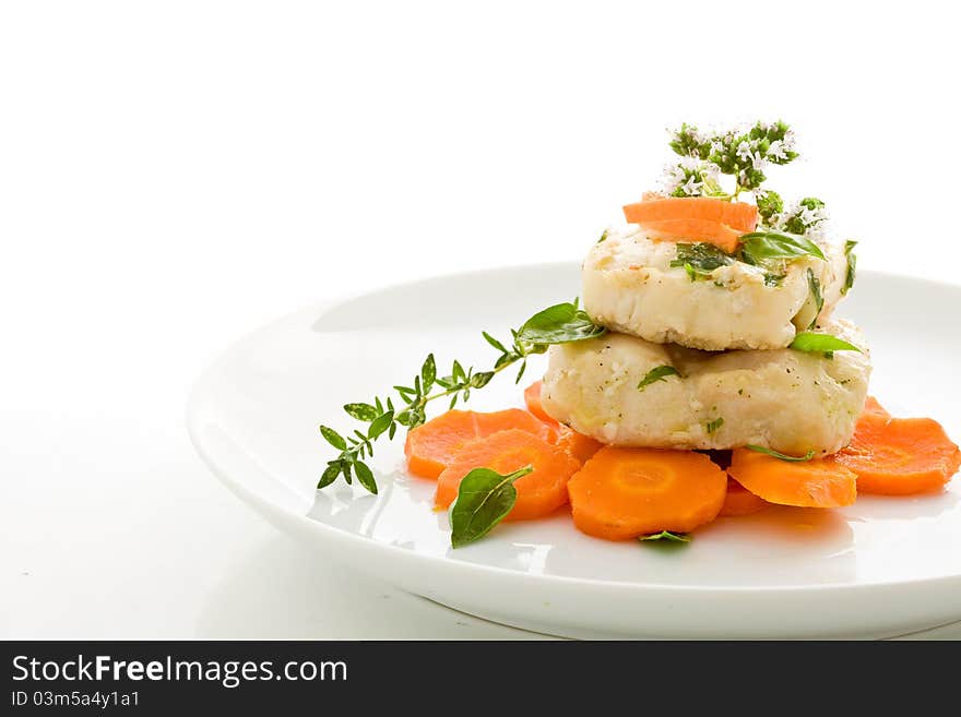 Photo of delicious cod over carrots on isolated white background. Photo of delicious cod over carrots on isolated white background