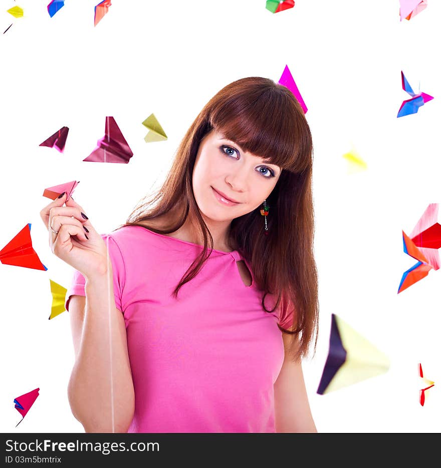 Young woman holding paper airplane