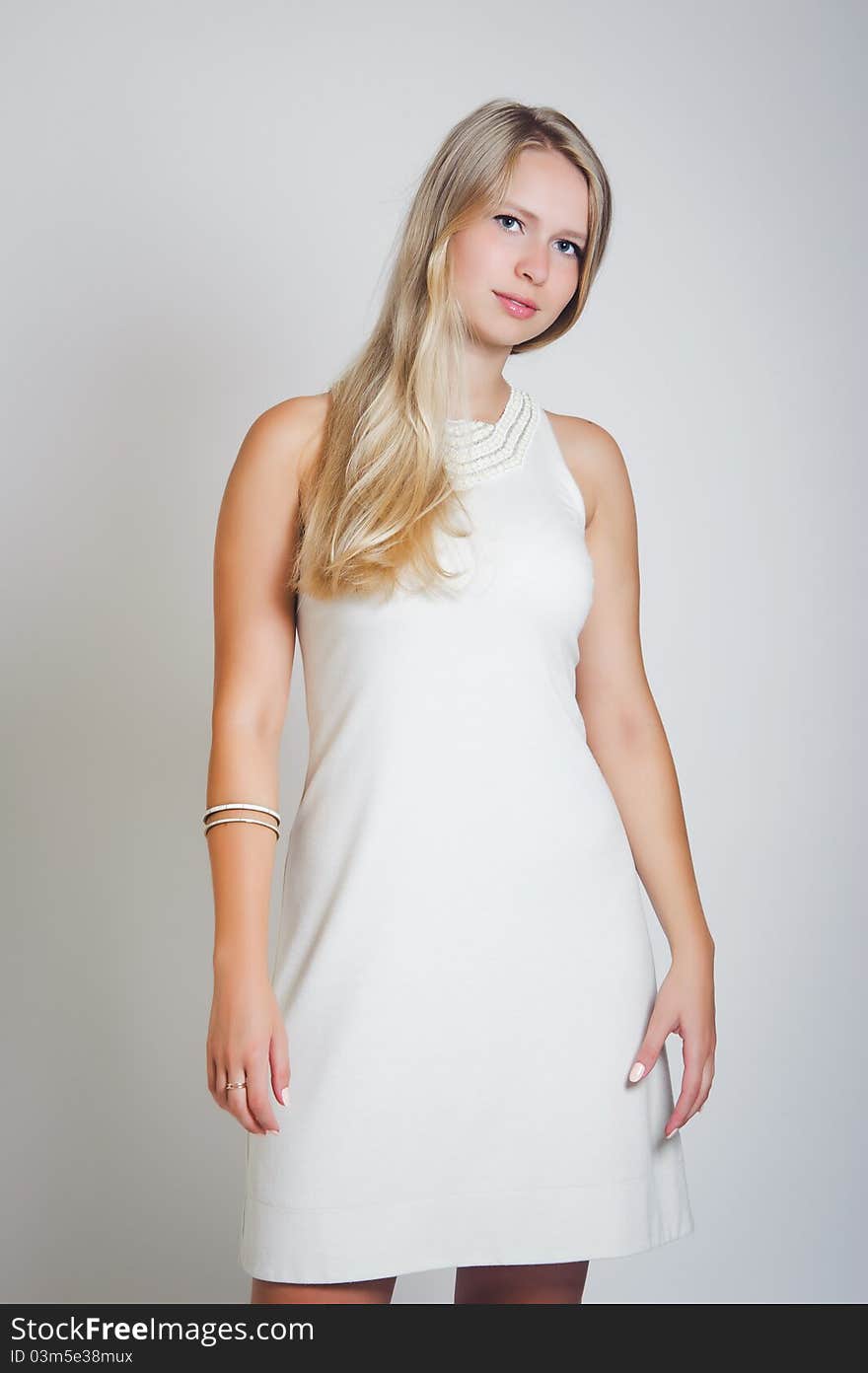 Portrait of young attractive woman against a white background