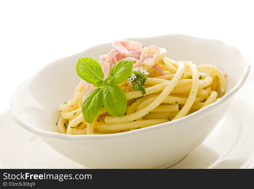 Photo of delicious pasta with sour cream and ham on isolated background. Photo of delicious pasta with sour cream and ham on isolated background