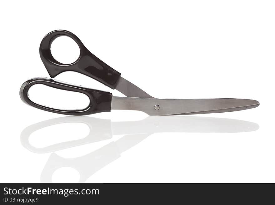 A pair of black scissors against a white background