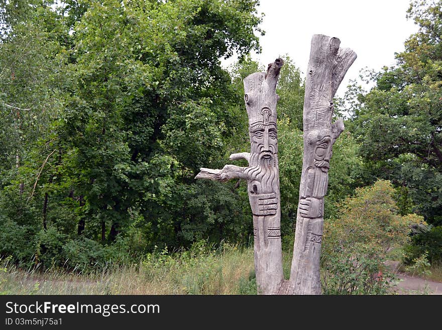 Figures of wooden people. Fantastic beings. A nature sanctuary