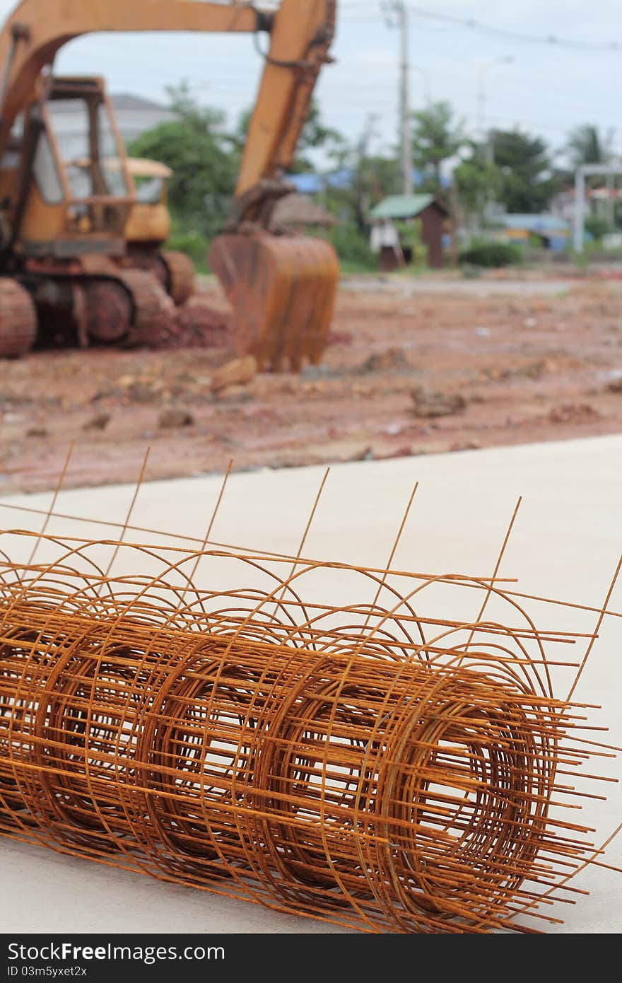 Excavator car and steel bars