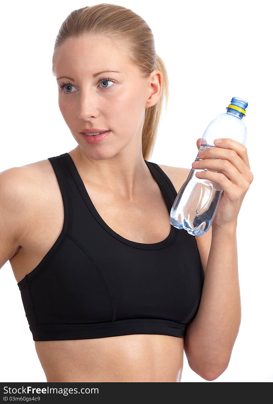 Caucasian woman with sport-bra drinking water