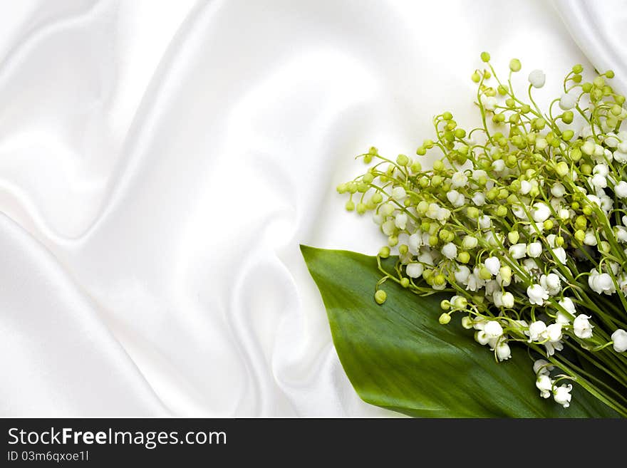 Lily Of The Valley And White Silk Background