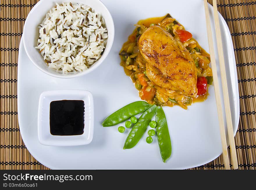 Chickens with vegetables, rice and soy sauce. Chickens with vegetables, rice and soy sauce