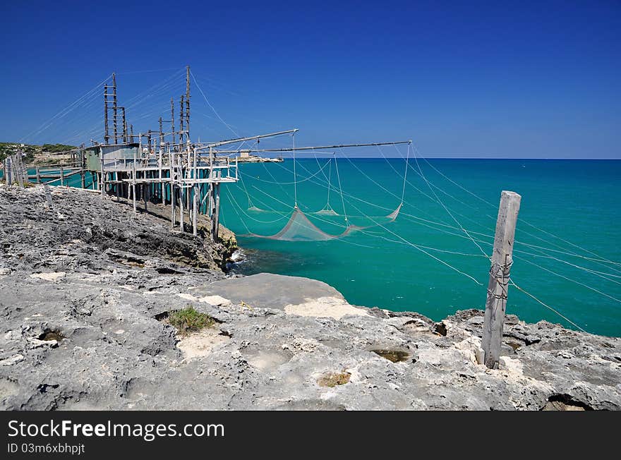 Trabucco is an old fishing machine typical of the coast of Gargano in the Apulia region of southeast Italy. It is protected as historical monument. Trabucco is an old fishing machine typical of the coast of Gargano in the Apulia region of southeast Italy. It is protected as historical monument.