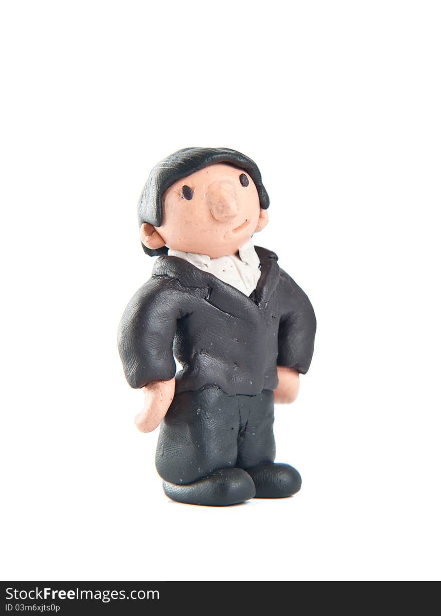 Little guy made of modelling clay wearing a suit and thinking. Little guy made of modelling clay wearing a suit and thinking.