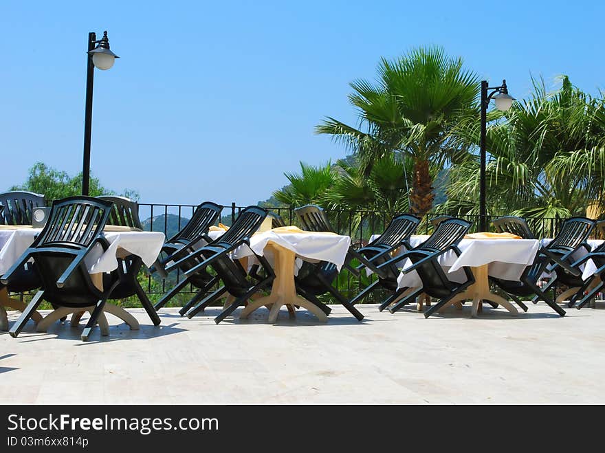 Empty Summer Cafe Open Air. Wind is blowing. It's daytime. There is nobody. Empty Summer Cafe Open Air. Wind is blowing. It's daytime. There is nobody