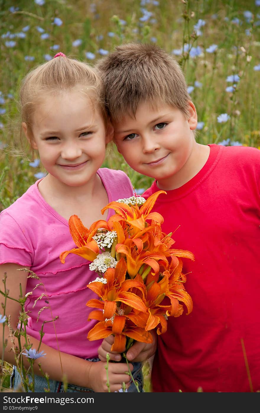 Boy and girl with a bouquet of  lilies