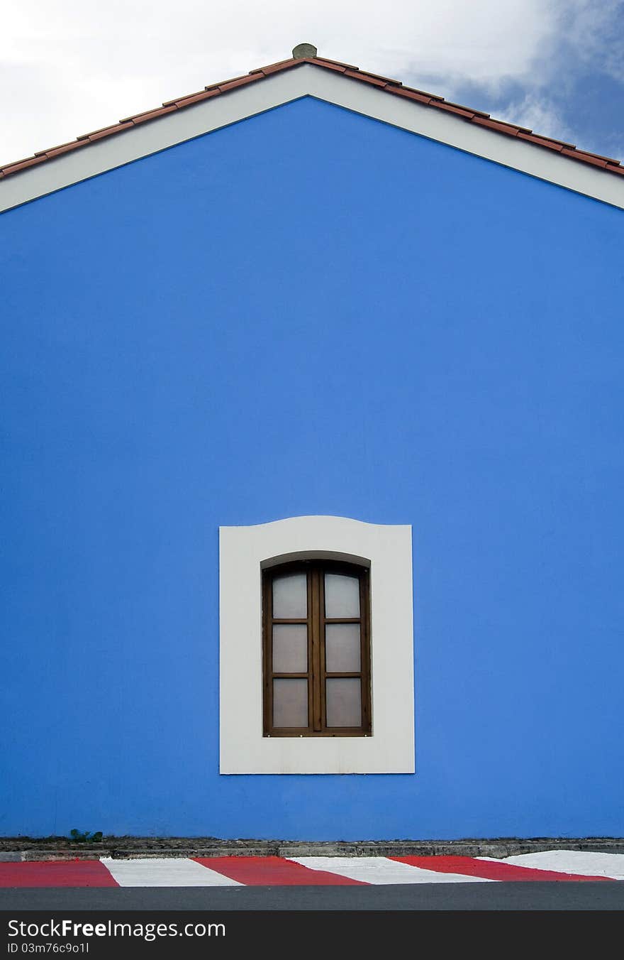 Simple blue house with a window