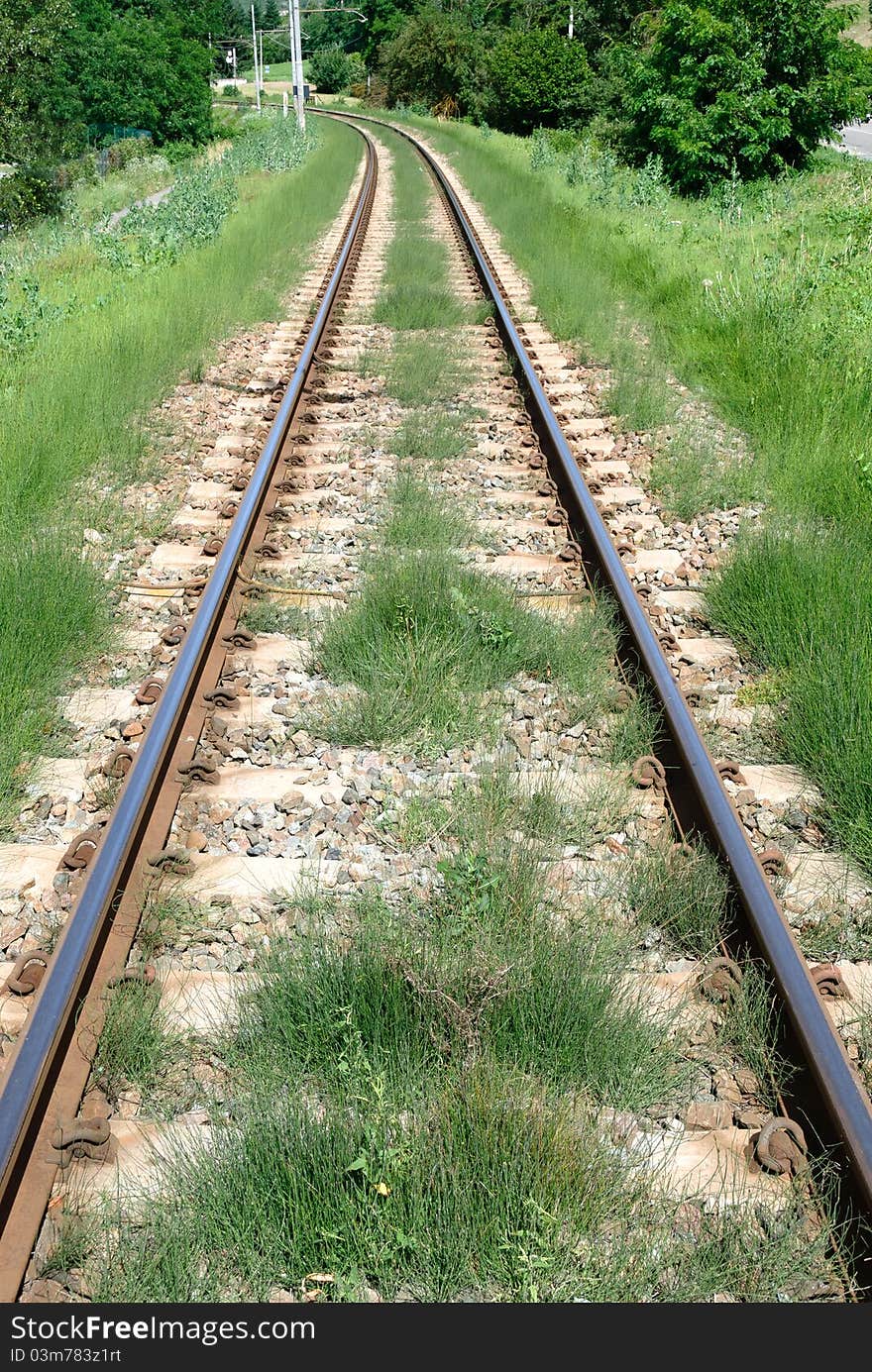 Railroad tracks with grass in Piedmont