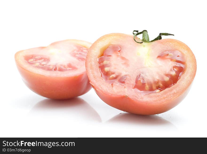 Fresh tomatoes, sliced​​, on a white background