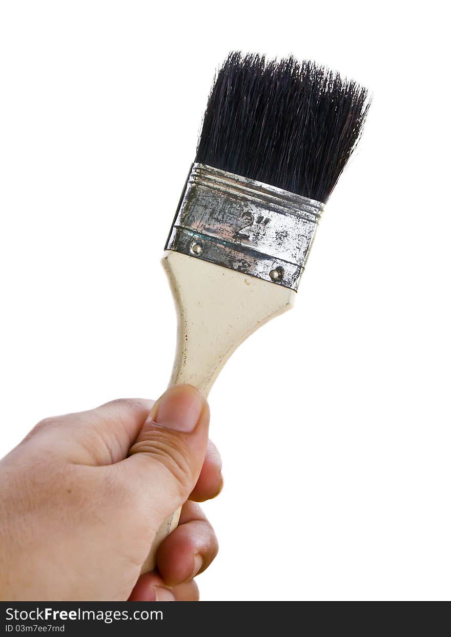 Paintbrush in hand isolated on white background