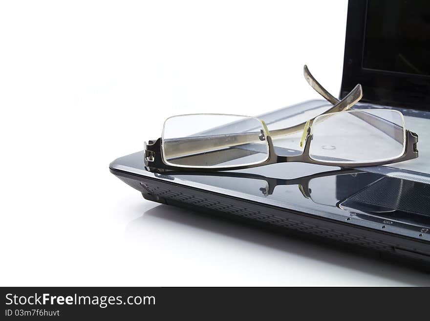 Glasses on computer isolated on white background. Glasses on computer isolated on white background