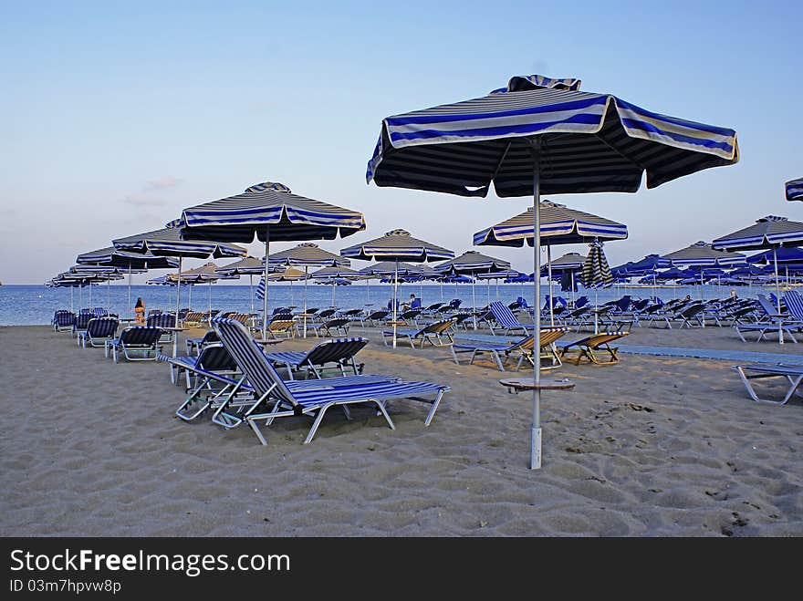 Beach, sunbeds and parasols