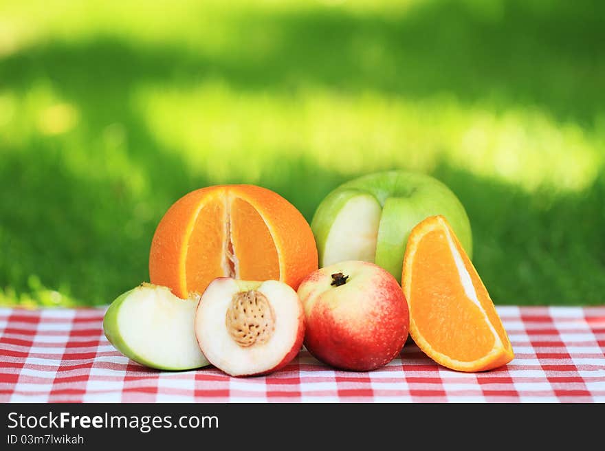 Fresh fruits on the table in the summer garden