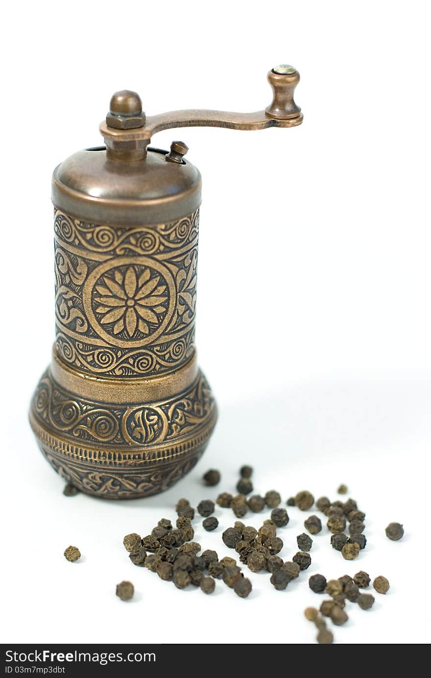 Antic pepper grinder with pepper grains