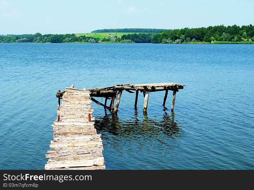 View of the river with a wooden pier