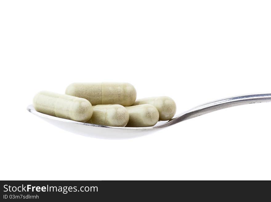 Isolated spoon of drugs in white background