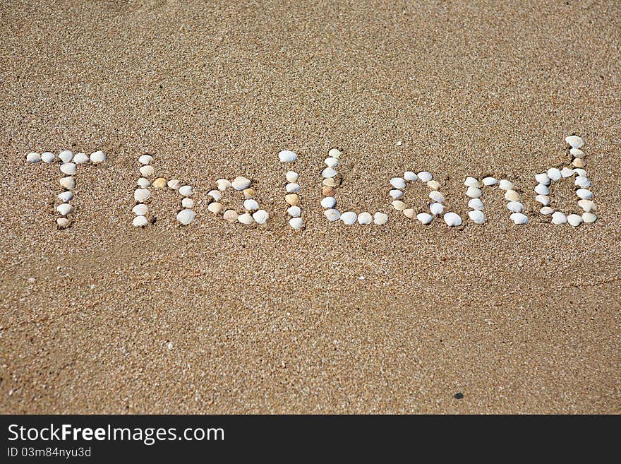 Thailand, seashells written on the sand. Thailand, seashells written on the sand